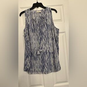 Love Stitch Halter Tassel Tie Tank is a size Large.